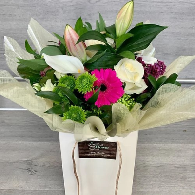 Candy Shimmer - Seasonal Flowers create this amazing bouquet hand tied and presented in a gift bag or box- just the perfect floral gift for anyone. Order for same day delivery