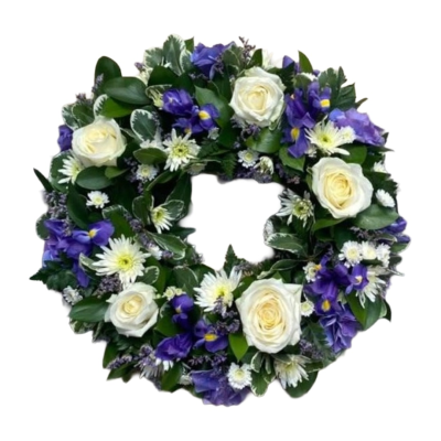 Gentle Grace Wreath - A graceful funeral wreath arranged in elegant white and rich purple tones with fresh greenery. Alternative colour choices can be requested in the Special Instructions when ordering.