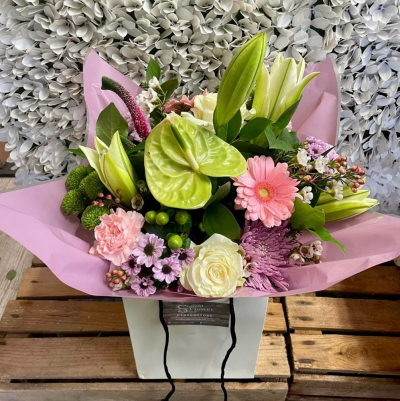 Pink Perfection - A handtied aqua pack bouquet wrapped in complementary cellophane, presented in water and a gift bag with a personalised message of your choice.

Please note that due to the season availability of flowers it may be necessary to vary individual stems from them shown. Our skilled florists may substitute flowers for one similar in style, quality and value. Where our designs include sundry items like a vase or a basket it may not always be possible to include the exact item as displayed. If such an occasion arises we will make every effort to replace the item with a suitable alternative.