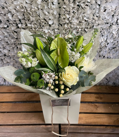 Timeless Classic - A handtied aqua pack bouquet wrapped in complementary cellophane, presented in water and a gift bag with a personalised message of your choice.