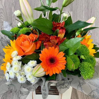 Sunrise Sensations - A handtied aqua pack bouquet wrapped in complementary cellophane, presented in water and a gift bag with a personal message of your choice.