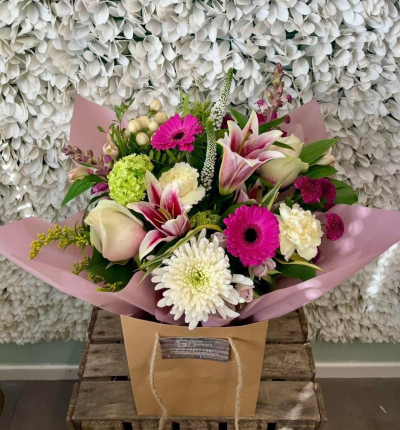 Pink Spark - A vibrant bouquet in striking pink and soft white tones, complemented by fresh green accents for a bright and stylish finish.